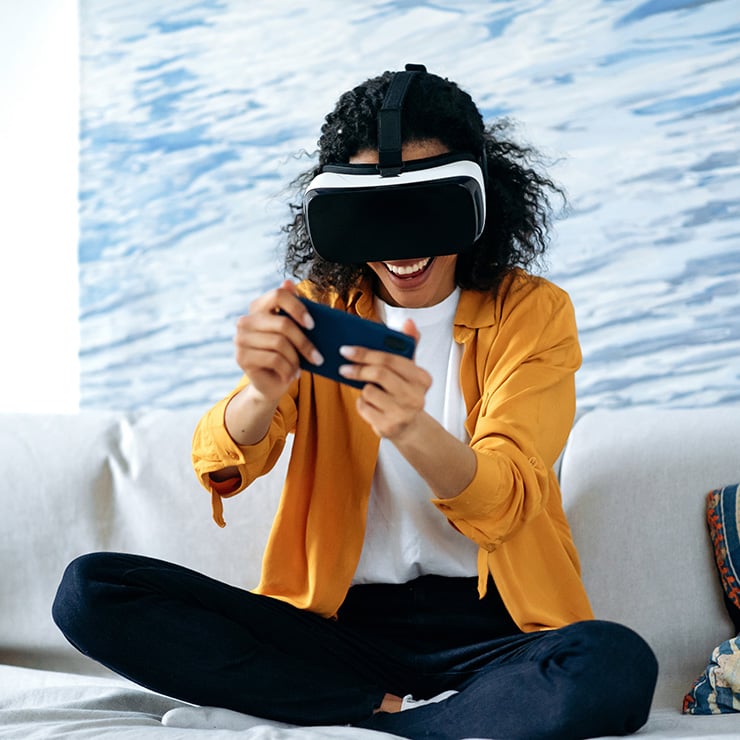 Woman playing game on VR headset