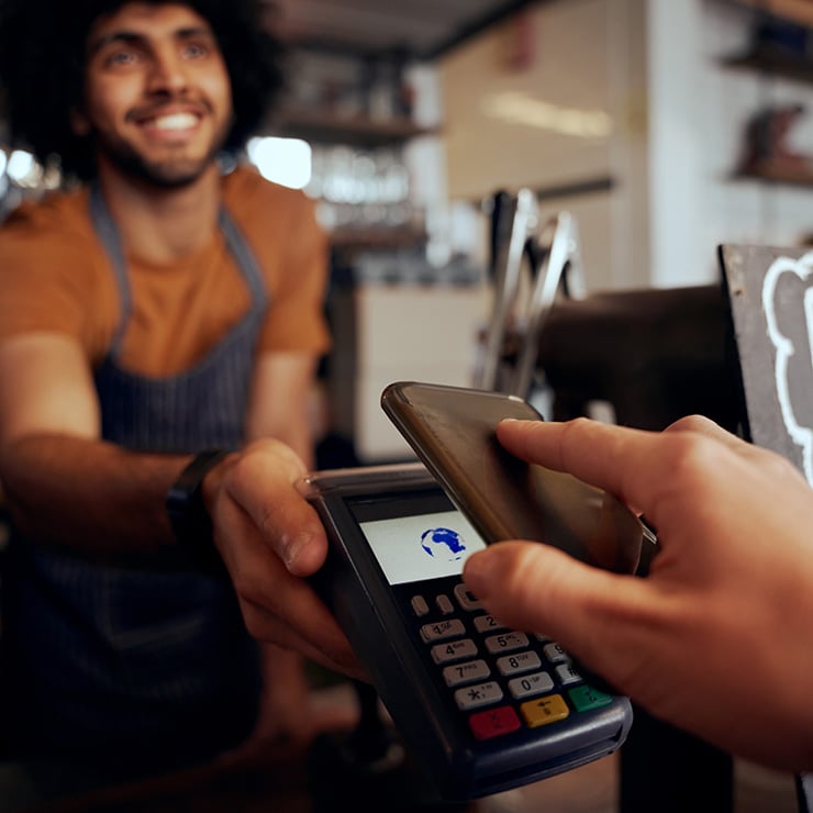 Person paying at cafe with phone