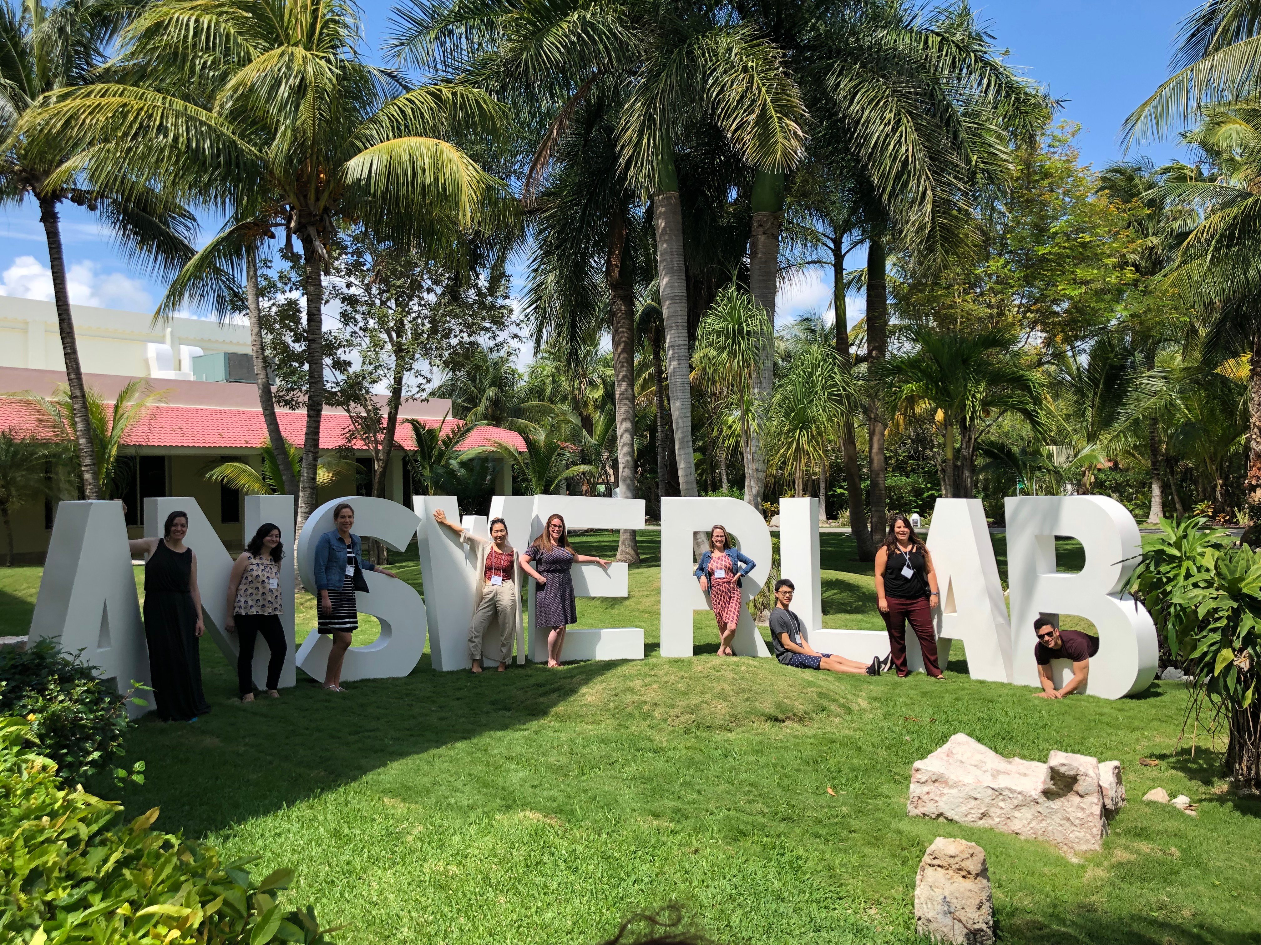 Group photo outside in front of 6 foot letters spelling AnswerLab Group photo outside in front of 6 foot letters spelling AnswerLab