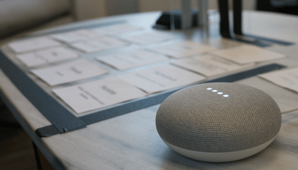 google home mini with personality trait cards in background