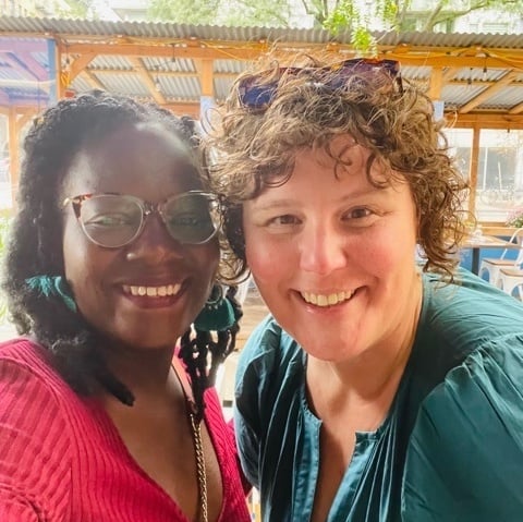Two people smiling at the camera