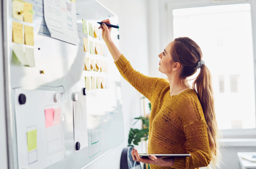 Woman working on whiteboard