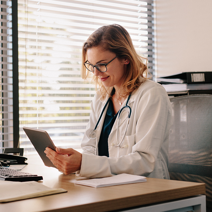 Healthcare practitioner using a tablet