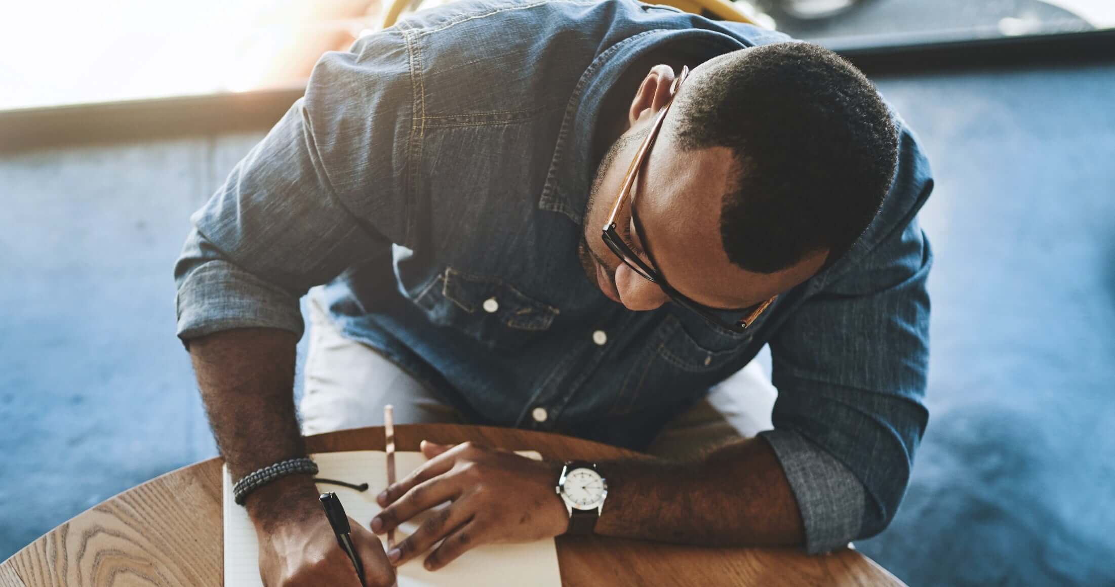 Man writing on a sheet