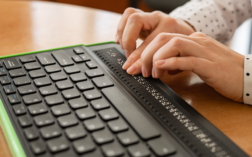 Person using a braille reader.