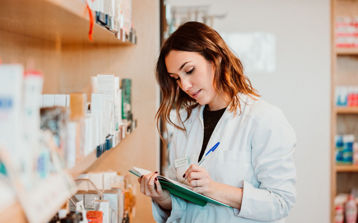 female pharmacist ordering medications in a pharmacy