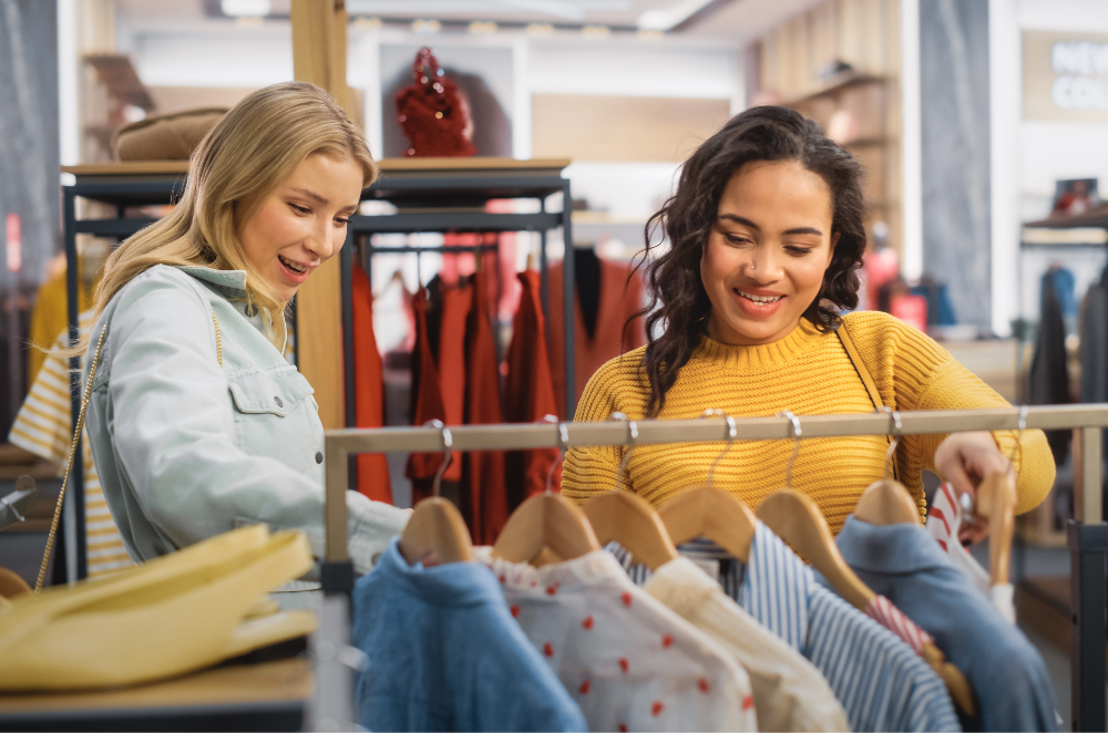 Two people shopping in clothing store