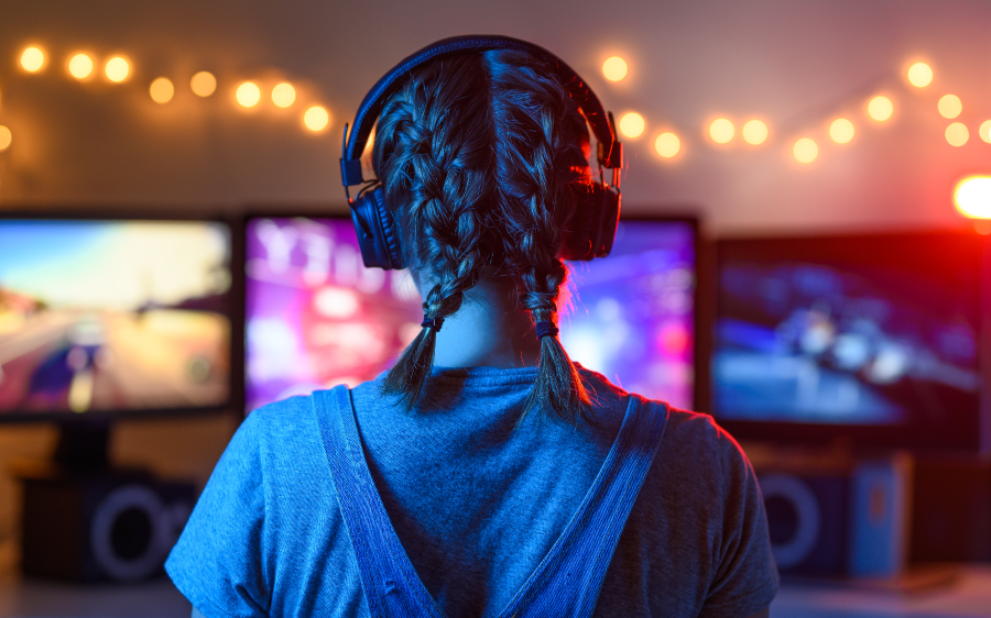 girl playing video game on computer